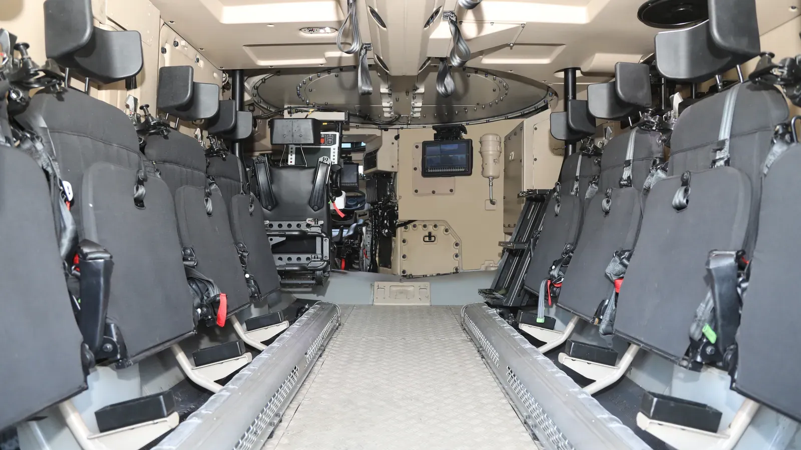 Troop compartment with blast-attenuating seats